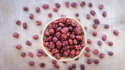 Top view close up, dried jujube in wooden basket for traditional Chinese herb ,copy space for your text.