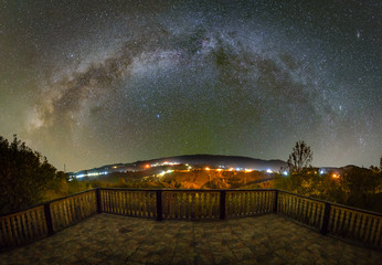 Milky way over the Pestera village in Piatra Craiului mountains from Romania