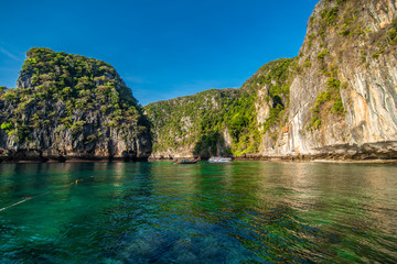 Naklejka na ściany i meble The beaches of Ko Phi Phi Islands and the Rai ley peninsula are framed by stunning limestone cliffs. They are regularly listed between the top beaches in Thailand.