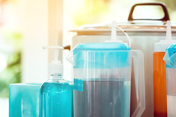 Blue alcohol gel bottle to prevent germs and the corona virus (Covid-19) before drinking water and eating in the student cafeteria.