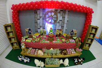 Child's birthday. Farm theme. Cake table with sweets and decoration