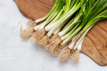 Fresh red and white onions on white background