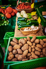 Market display at a German weekly market with different types of vegetables.