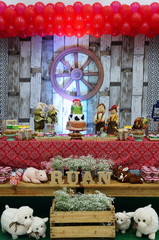 Child's birthday. Farm theme. Cake table with sweets and decoration