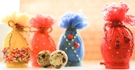 Colorful Easter eggs in colored lace on a light background