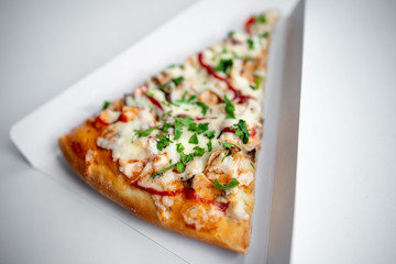 slice of delicious pizza delivered home