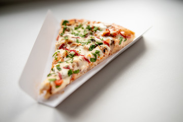 slice of delicious pizza delivered home