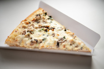 slice of delicious pizza delivered home