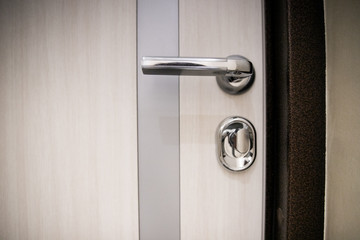 Obraz premium Modern, contemporary satin handle and keyhole detail