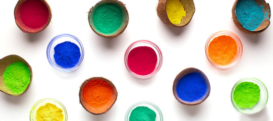 Bright dry powder in transparent bowls and coconuts
