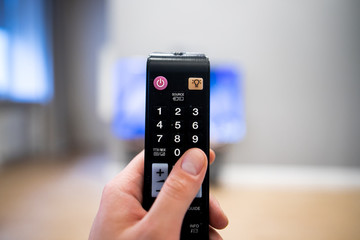 Watching tv and using remote control