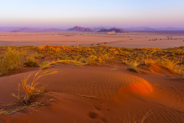 View of Sesriem at sunset from the top of the Elim dune in Namibia in Africa. 