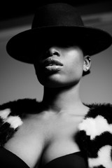 Black and white fashion portrait of african woman with sexy neckline