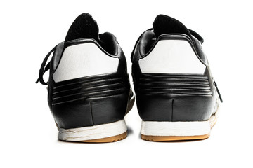 Worn out shoes showing feet problems isolated on white