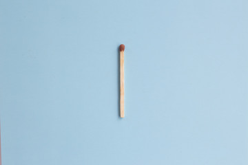 Match on a blue background, the concept of fire, fire, fire, fire, heat, heating. Card with copy space for text