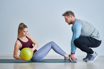 Woman with her personal fitness trainer