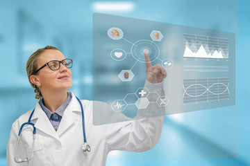 Doctor with virtual displays. Female doctor analyzes the patient's history on a technological digital futuristic virtual holographic interface. Doctor and futuristic concept of medical interface.