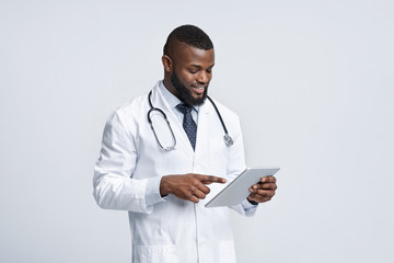 Modern african medical doctor using digital tablet