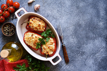 Baked stuffed bell peppers on the kitchen table.