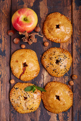 Delicious small sweet pies filled with apples, cinnamon and hazelnuts