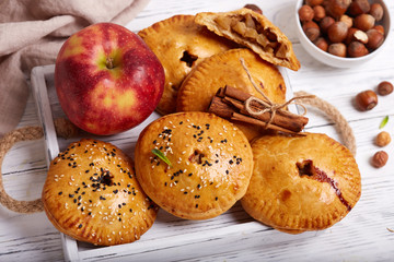 Delicious small sweet pies filled with apples, cinnamon and hazelnuts