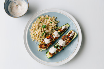 Vegetarian meal of roasted courgettes and bulgar wheat on plate