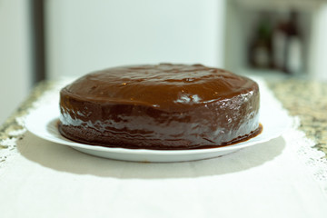 Homemade carrot cake with chocolate topping ready to eat. Homemade recipe.