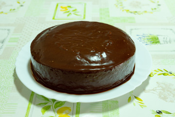 Homemade carrot cake with chocolate topping ready to eat. Homemade recipe.