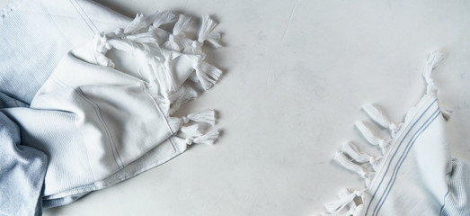The soft terry towel is made of cotton and linen with contrasting stripes and fringe lies on the...