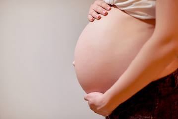 Close-up of unrecognizable pregnant woman