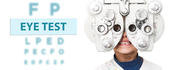 Child eye test and eye exam. Little girl having eye check-up, with phoropter. Eye test for children - Powered by Adobe