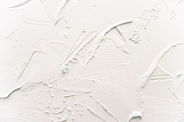 the texture of decorative plaster is light blue. Scratches and relief on the wall. Background.