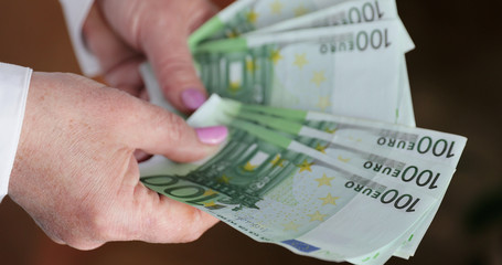Euro banknotes in woman hands. Euro Money. European Euro bills