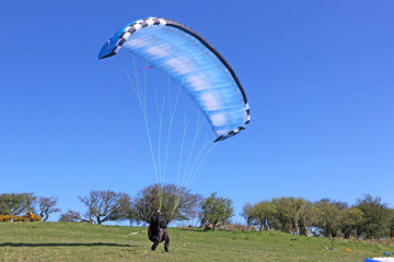 Paraglider launching at Milk Hill, England	