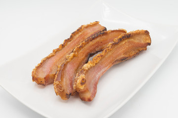torrezno slice of bacon white background