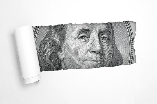 Benjamin Franklin on a Hundred Dollar Bill in the Hole of Torn White Paper. 3d Rendering