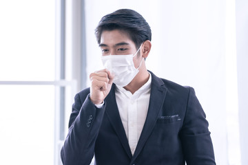 A business man is getting sick in office