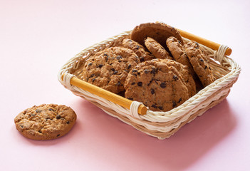 Delicious crumbly oatmeal cookies on a pink background