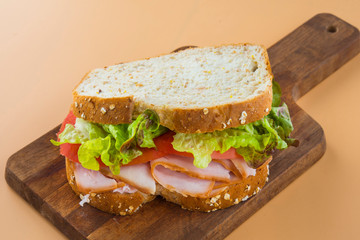 Sandwich of tomato, lettuce and smoked turkey