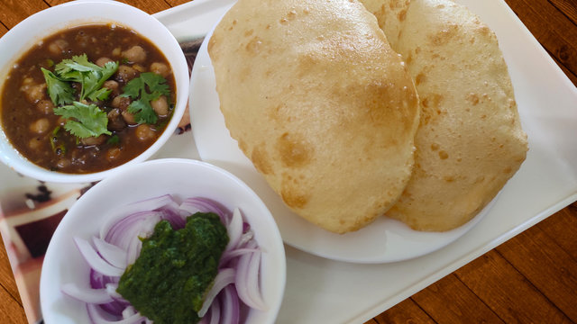 Home Made Chole Bhature on Wooden Table - Indian Cuisine