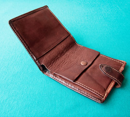 Empty wallet with no money in the background.
Bankruptcy is an empty wallet.
It is not possible to repay the loan and mortgage.
Old and empty brown wallet