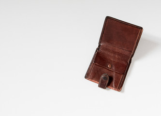 Empty wallet with no money in the background.
Bankruptcy is an empty wallet.
It is not possible to repay the loan and mortgage.
Old and empty brown wallet