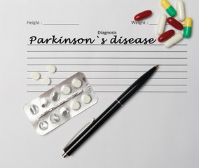 Parkinson`s disease diagnosis written on a white piece of paper.