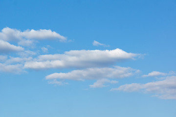 beautiful blue sky and a few white clouds on it.sky background with clouds