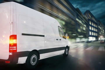 Fototapeta na wymiar Super fast delivery of package service with a fast moving van on cityscape