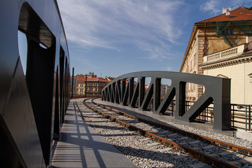 Fototapeta na wymiar train bridge in the city in Prague . Train railways in Czech