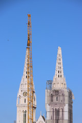 Fototapeta na wymiar Removal part of the left tower of Zagreb Cathedral, damaged in the earthquake of March 22. 2020. The right tower itself collapsed.