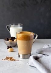 Dalgona coffee, new Korean drink, instant coffee whipped with sugar and added to iced milk. Trendy beverage. Copy space