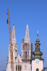Fototapeta na wymiar Removal part of the left tower of Zagreb Cathedral, damaged in the earthquake of March 22. 2020. The right tower itself collapsed.
