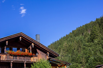Chalet with Flowers on the Balcony in Tyrol, Austria in Summer